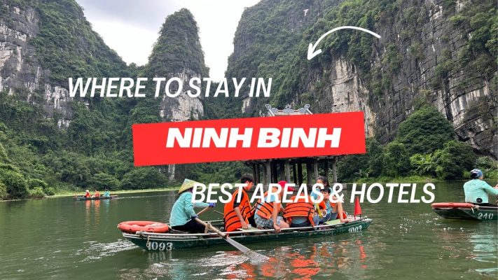 Tourists rowing boats through limestone mountains in Ninh Binh, Vietnam — a peaceful destination with many scenic places to stay